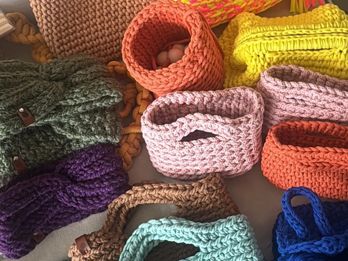 Colorful chunky crochet mini totes and baskets made in the workshop