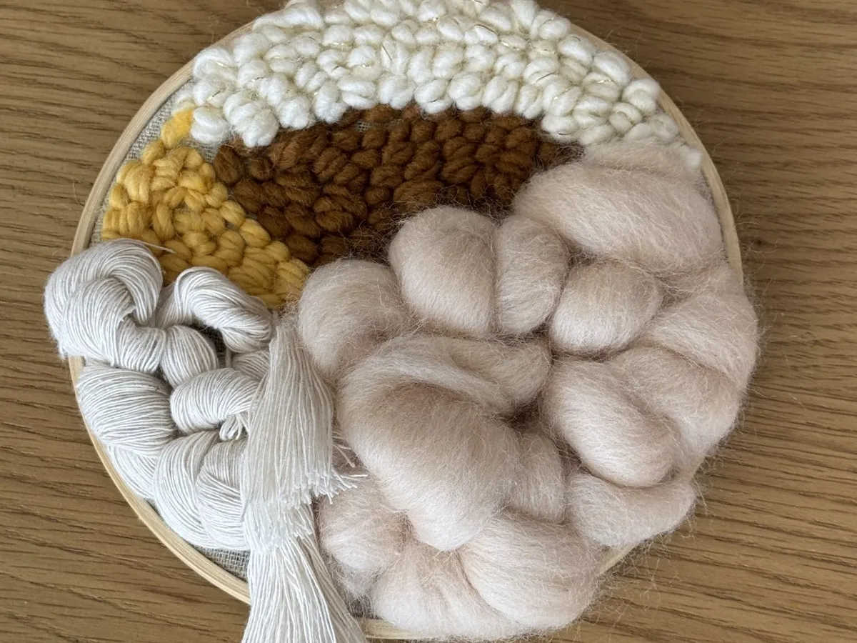 Punch needle hoop with mustard, cream and white wool loops and roving